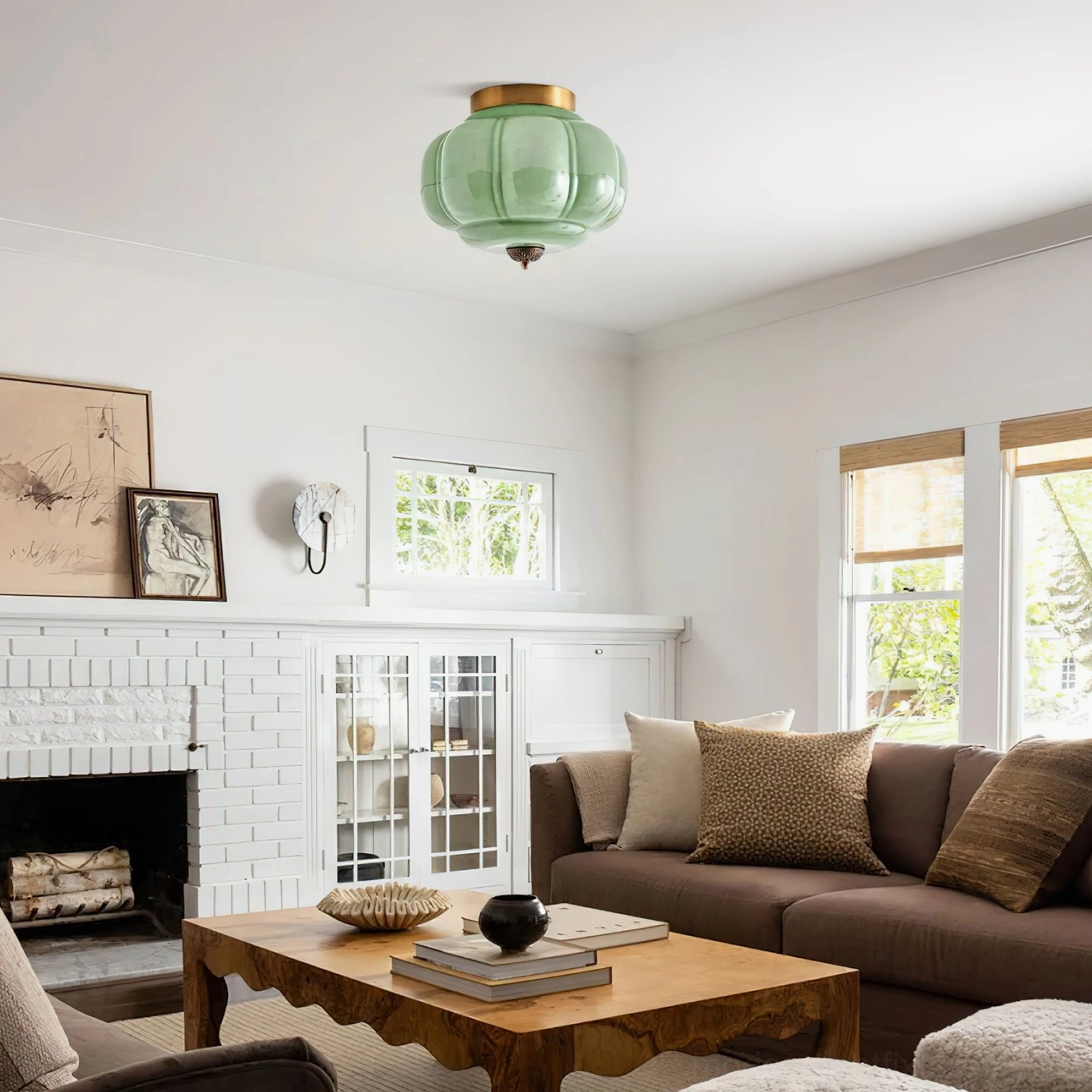 Maravine modern ceiling light fixture installed in contemporary bedroom, warm ambient lighting with handcrafted glass and brass metal detail