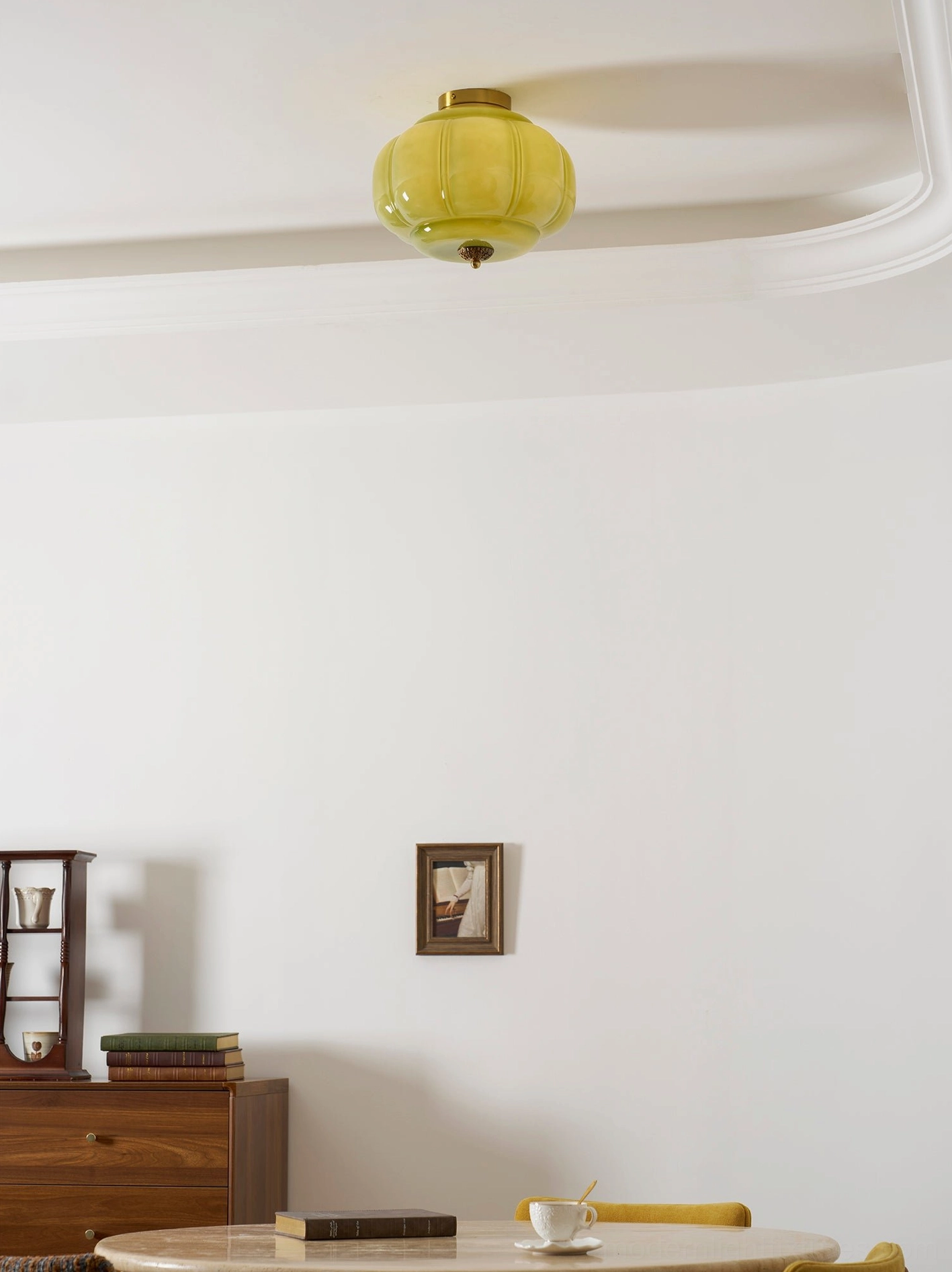 Maravine handcrafted glass ceiling lamp installed in entryway, warm ambient light with sculptural architectural presence