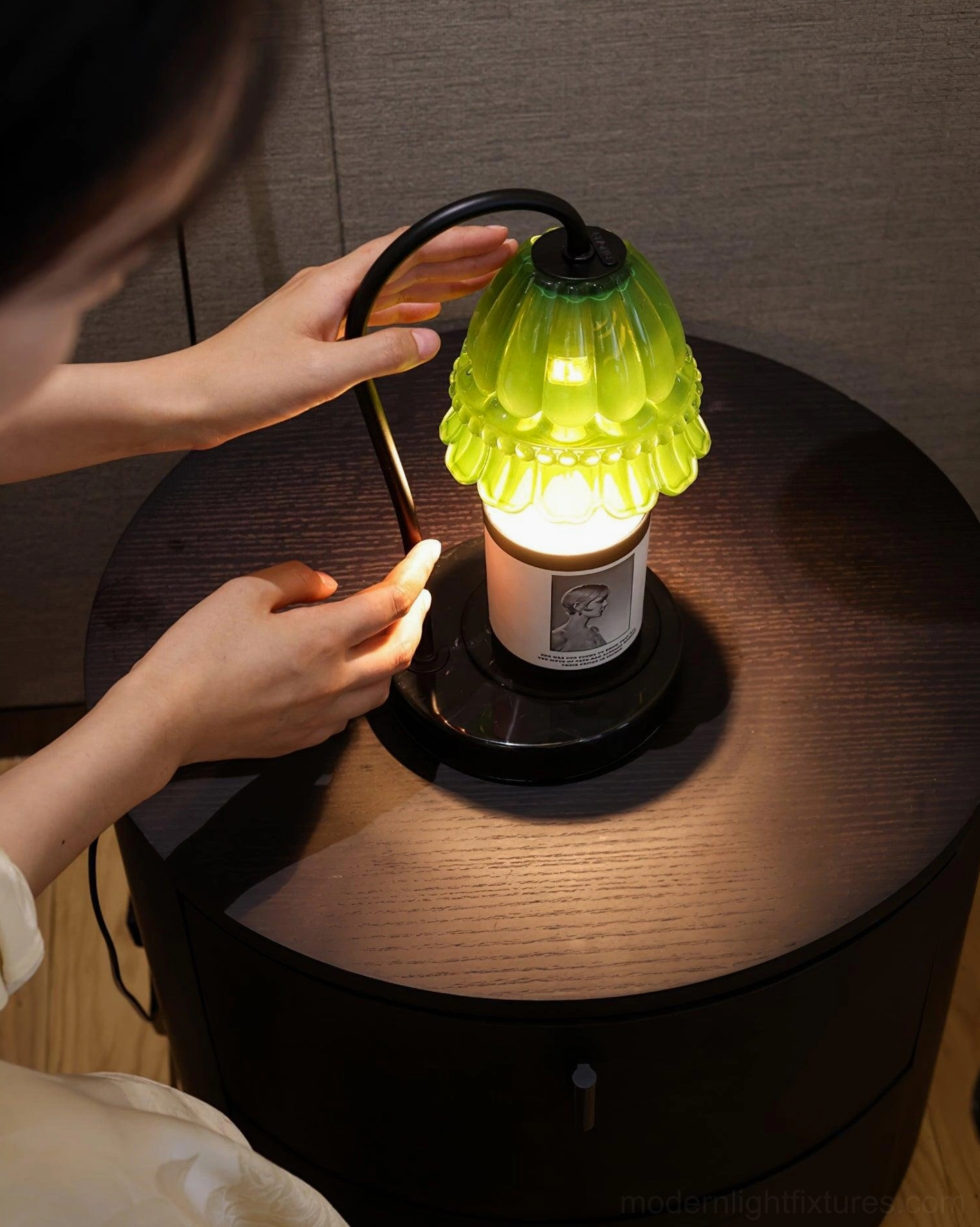 Modern candle warmer lamp with marble base and glass shade close-up detail