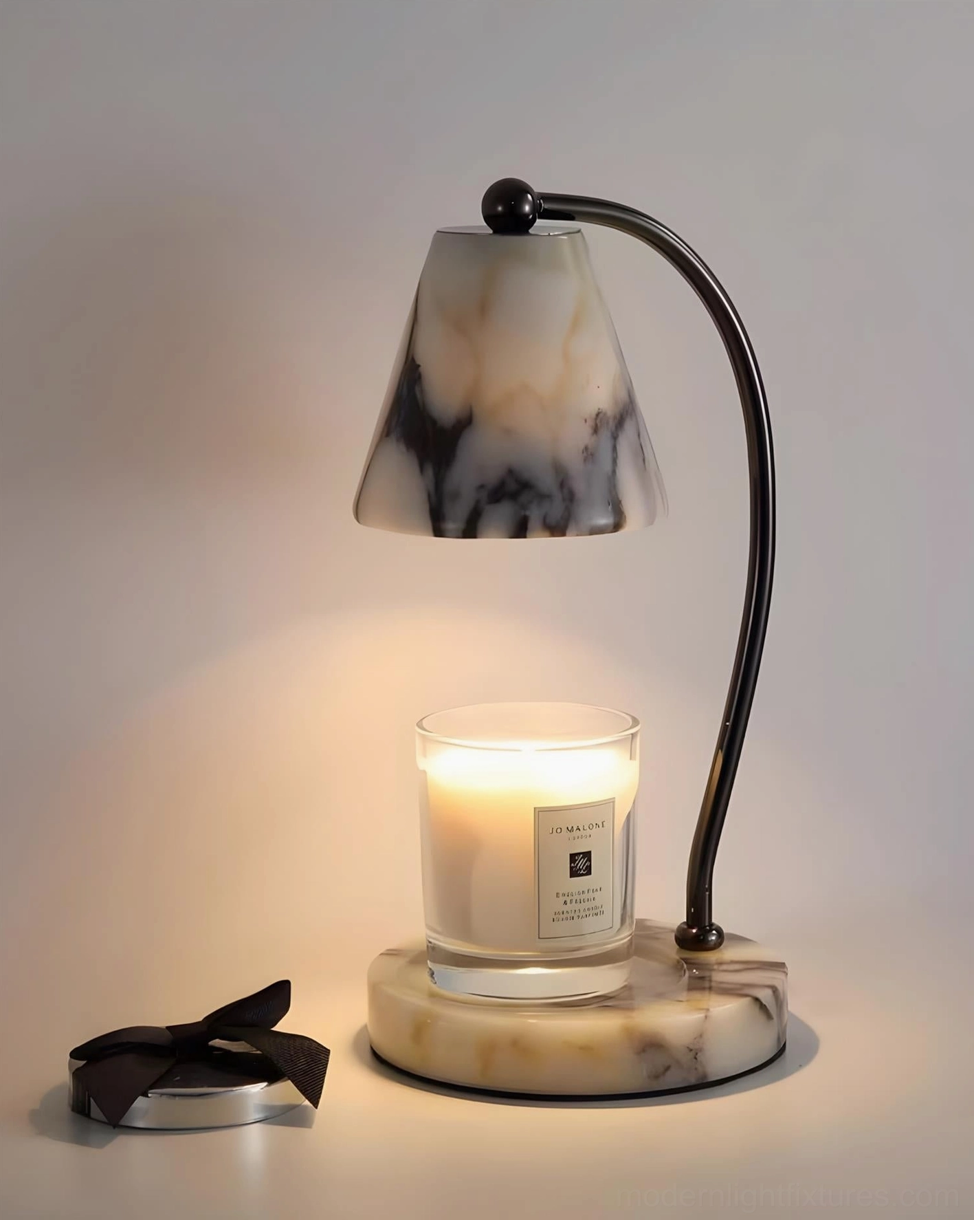 Contemporary table candle warmer lamp detail shot showing marble texture and brushed metal finish