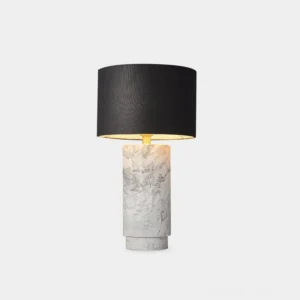Modern marble table lamp with black fabric shade and white veined marble cylindrical base, front studio view against plain background