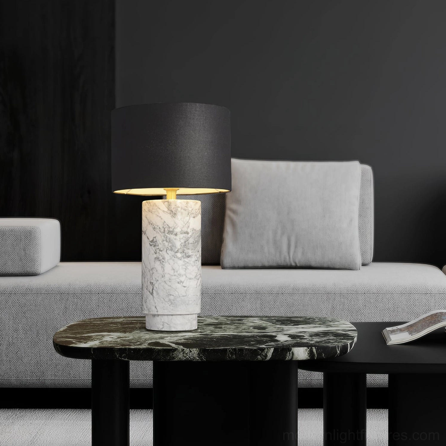 Contemporary marble table lamp in living room setting next to grey sofa with green marble accent table, eye-level perspective
