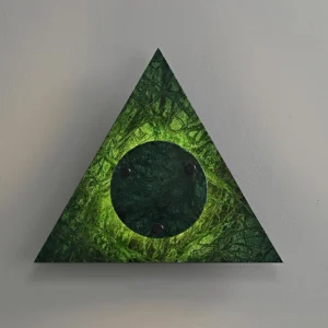 Close-up of green marble geometric wall lamp showing central illuminated disc detail