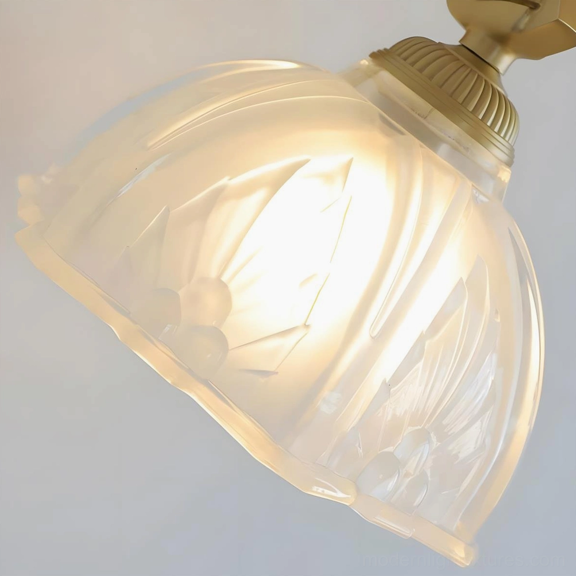 Marceau vintage wall sconce detail shot displaying hand-embossed glass dome with petal-and-leaf relief pattern