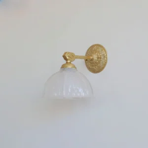 Marceau wall sconce side profile view displaying brass arm projection and floral-embossed backplate design