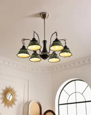 Marcella pendant chandelier illuminated overhead view in traditional European home interior showing green ceramic shades with warm lighting