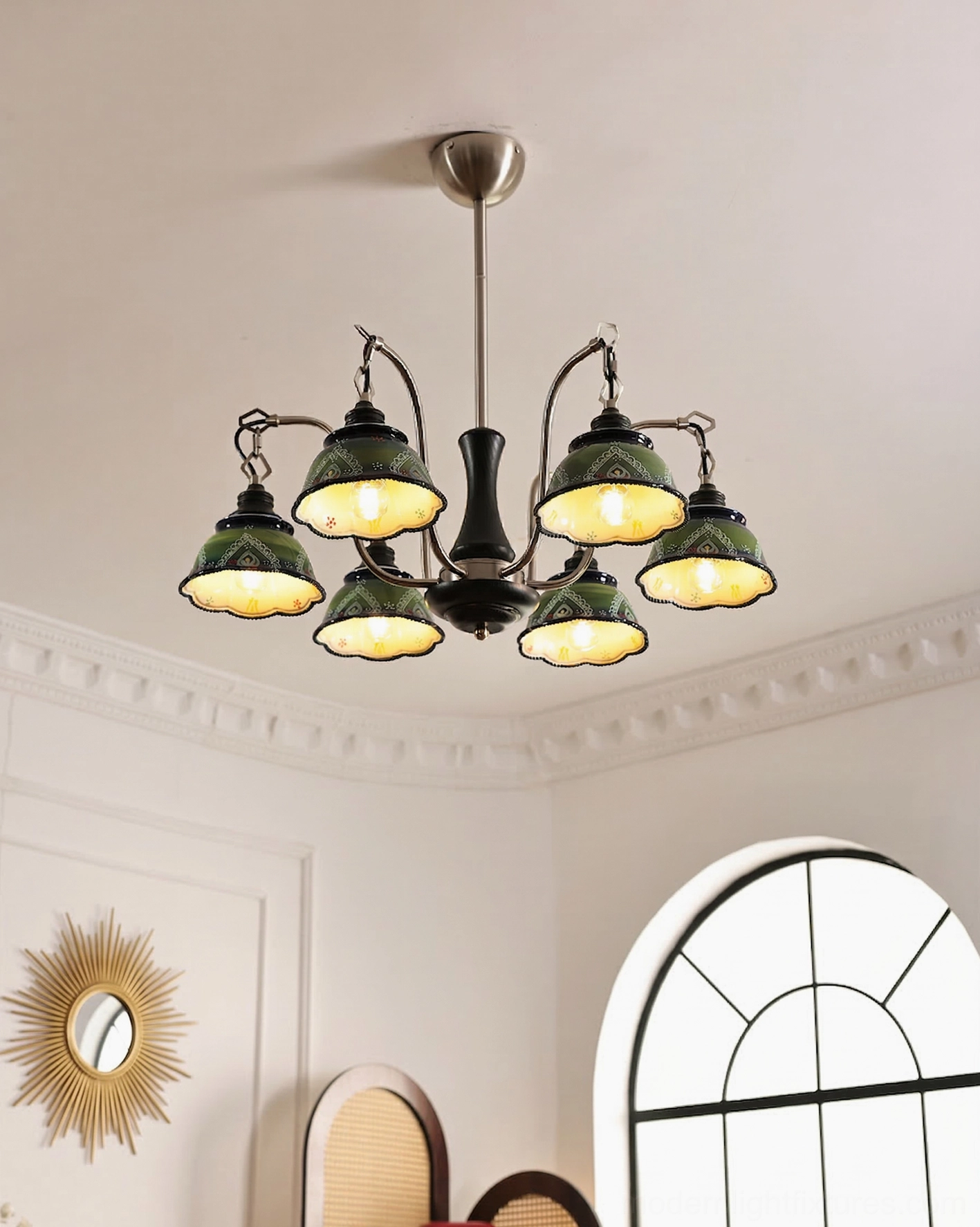 Marcella pendant chandelier illuminated overhead view in traditional European home interior showing green ceramic shades with warm lighting