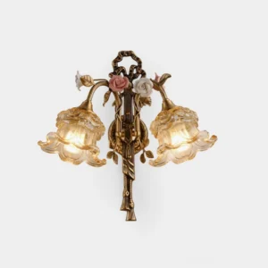 Margaux Fleur brass wall sconce with ceramic rose accents and ruffled cognac glass shade, front view on white studio background