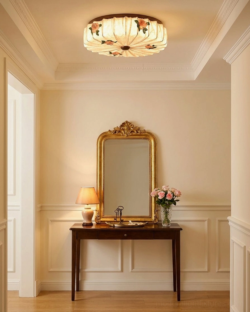 Maribelle fabric flush mount mounted on crown molding ceiling in elegant French style vanity space with soft warm lighting