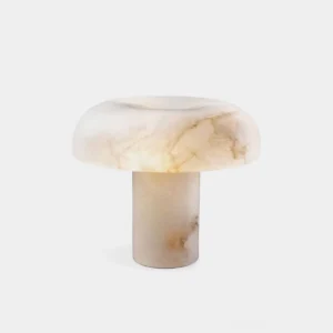 Marie natural alabaster table lamp front view studio white background warm glow