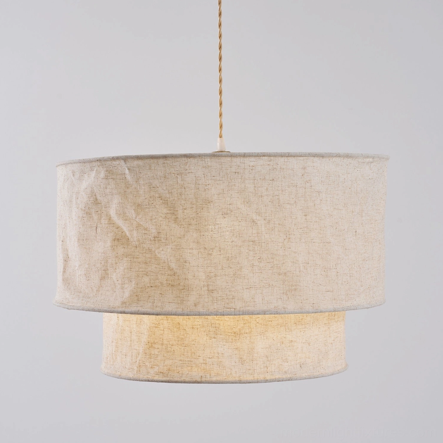 Double-layer fabric pendant light in contemporary minimalist home setting with soft illumination