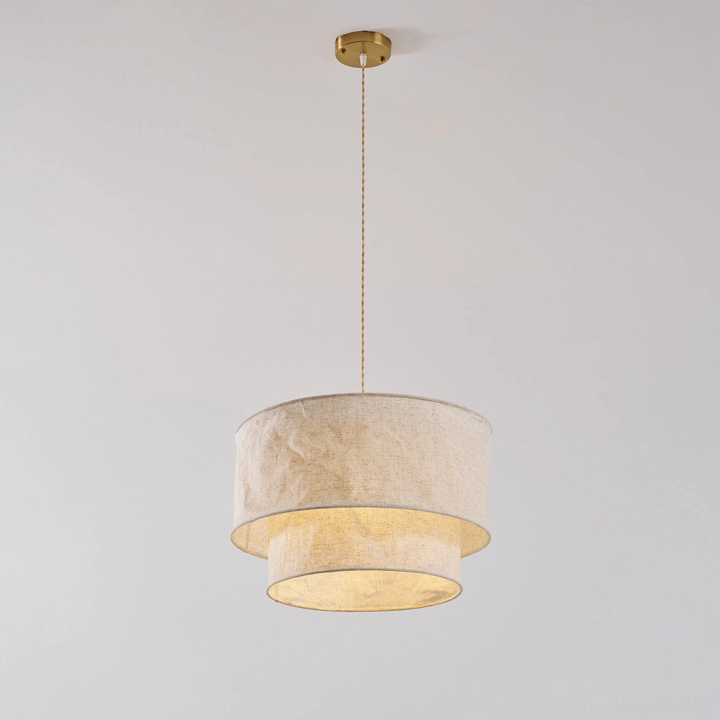 Two-tier crumpled fabric pendant shade showing texture detail and soft light diffusion quality
