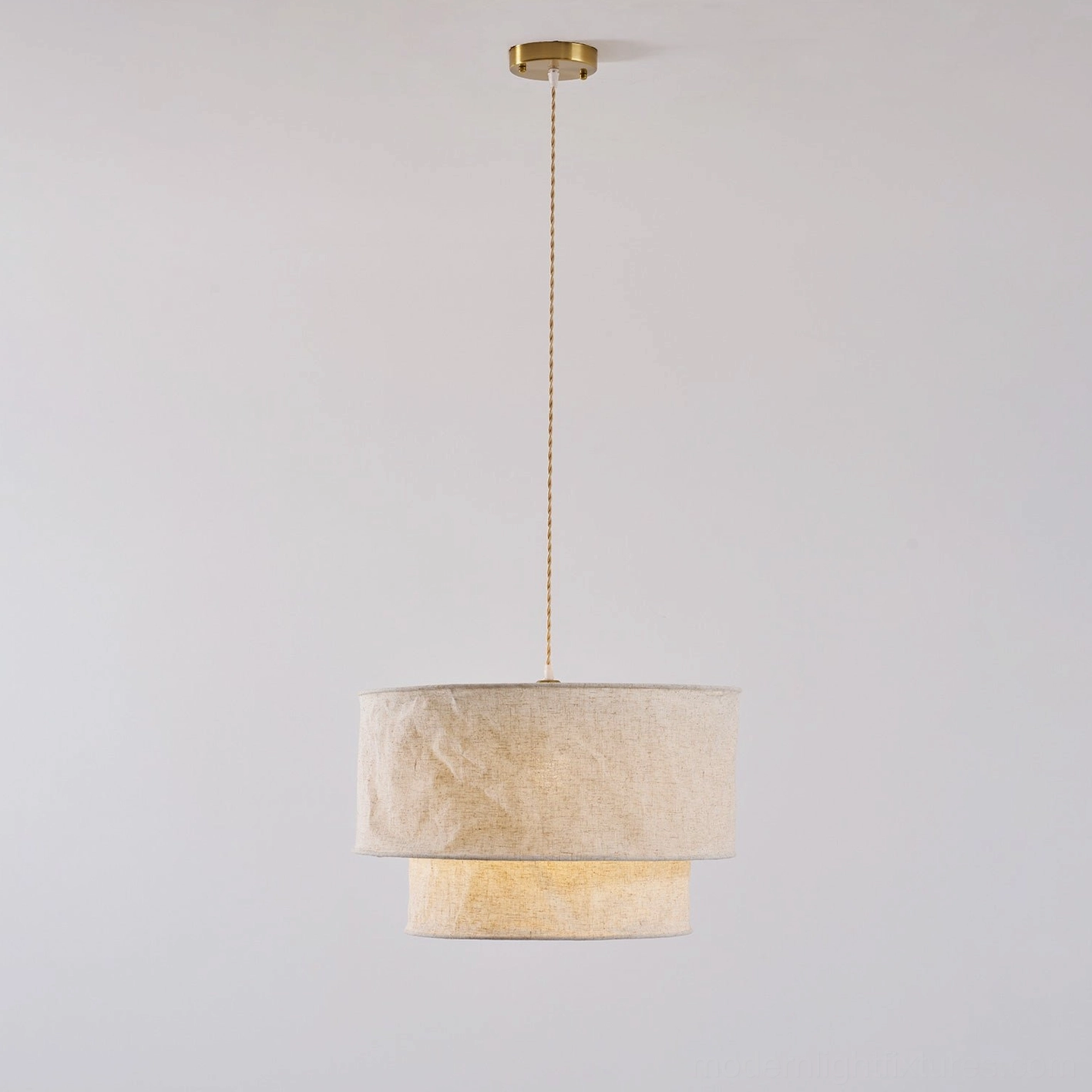 Mariela textured linen pendant light suspended in modern residential interior with warm lighting