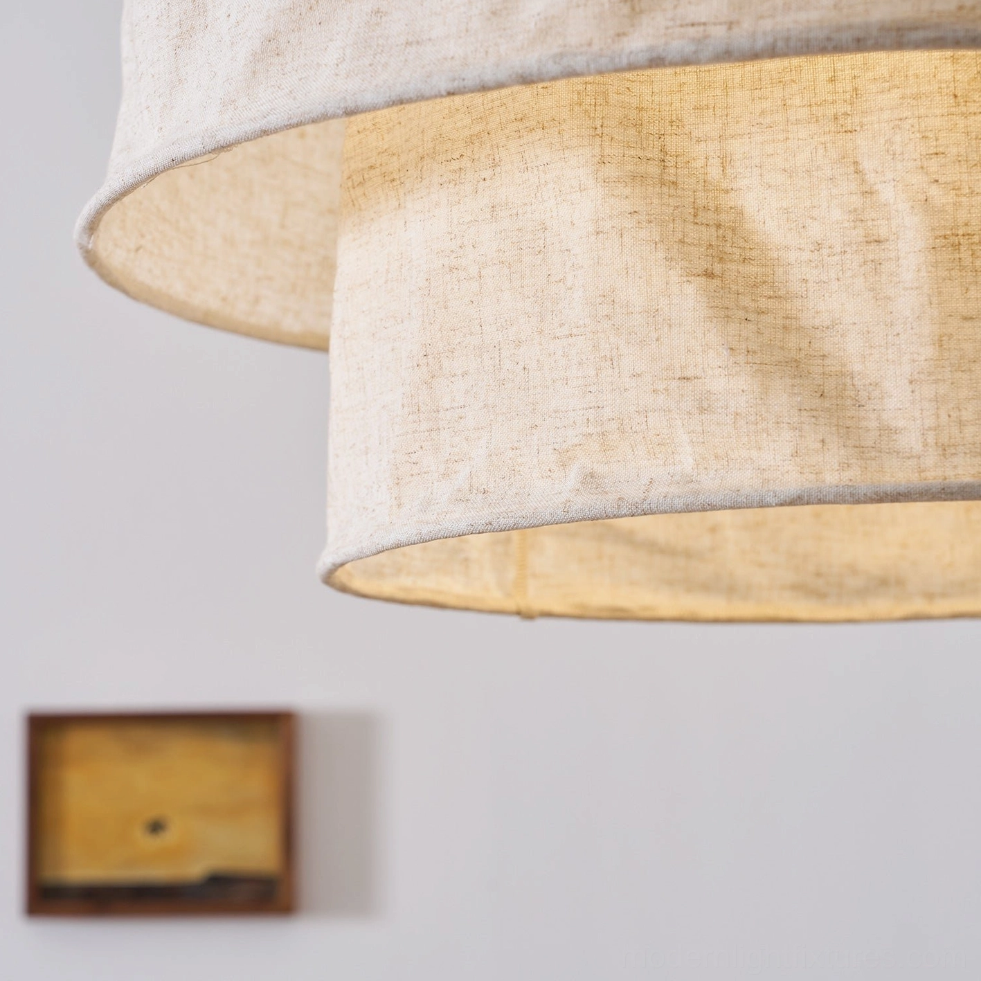 Two-tier crumpled linen fabric pendant lamp creating soft diffused lighting in modern space