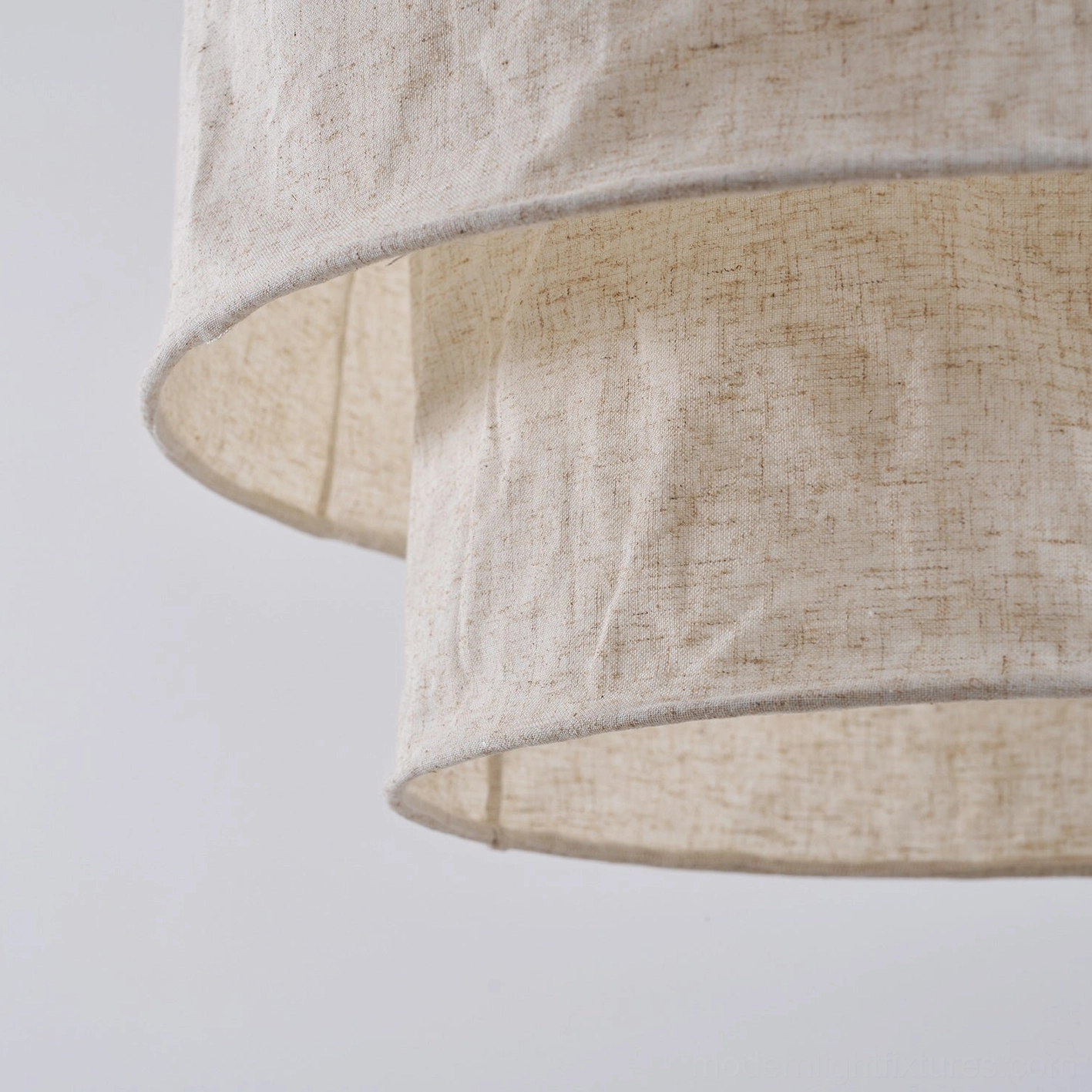 Mariela textured linen pendant light showing architectural mounting and warm atmospheric illumination