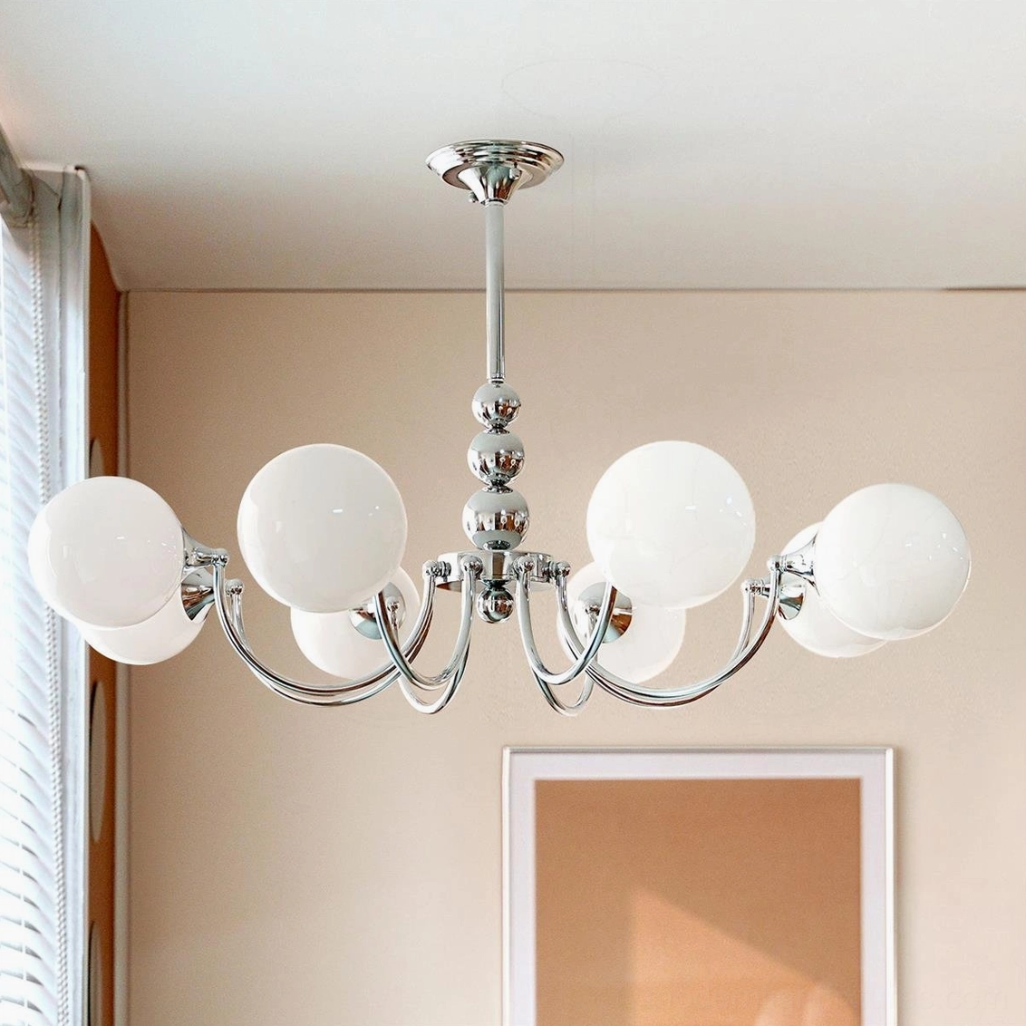 8-head Marielle chandelier with white globe shades and polished chrome frame, large installation view