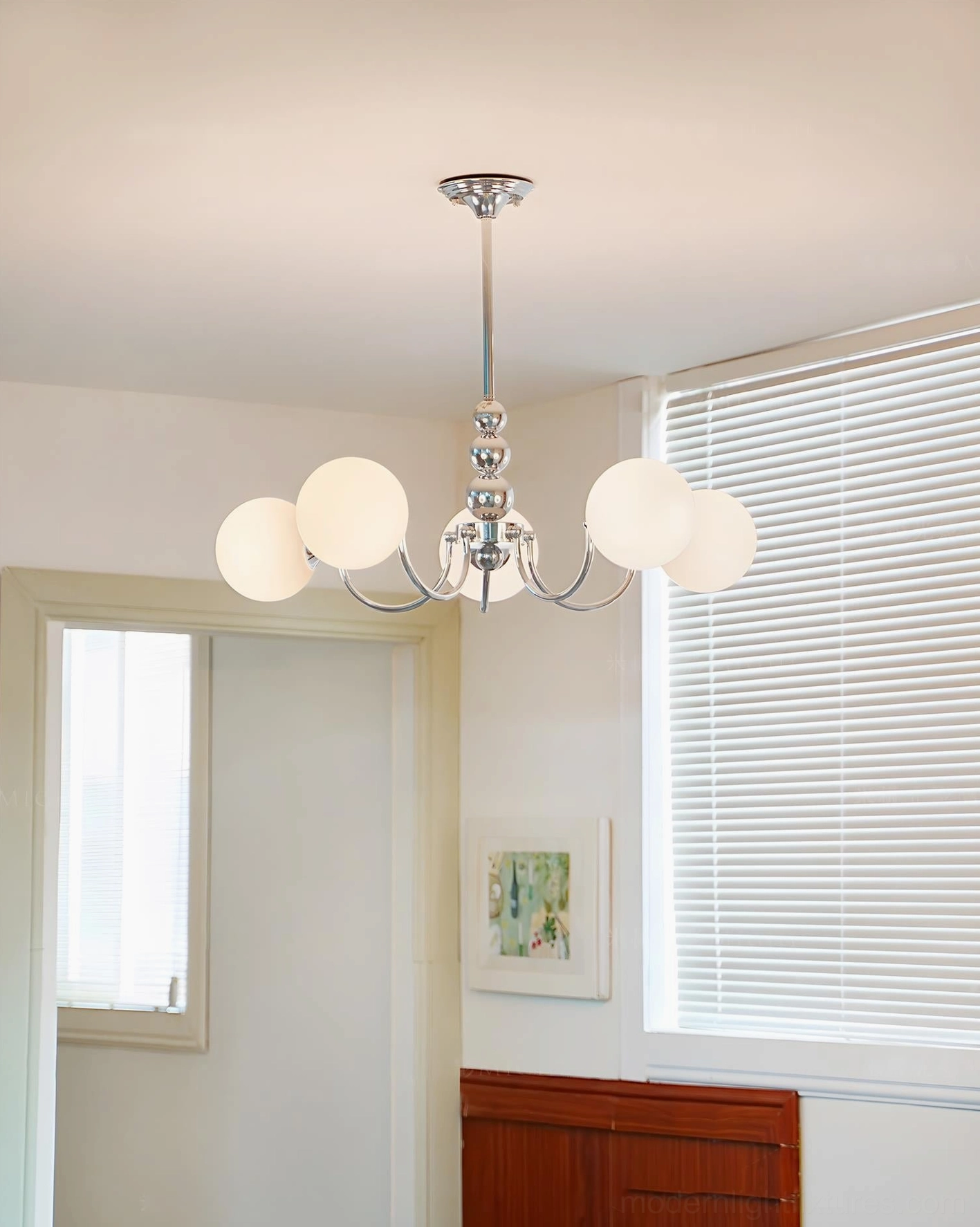 Marielle chandelier lighting comparison showing multiple globe shades creating balanced illumination