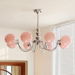 Pink globe branch chandelier with curved chrome arms, overhead living room installation with natural light