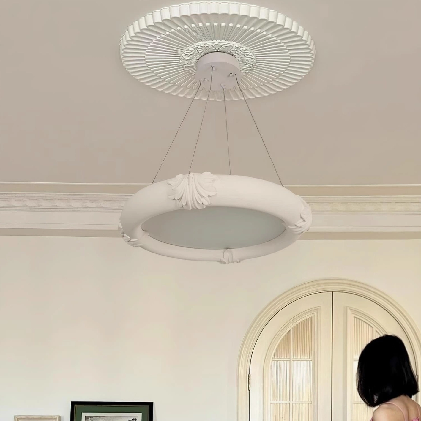 Contemporary white plaster chandelier with arched architectural ceiling detail