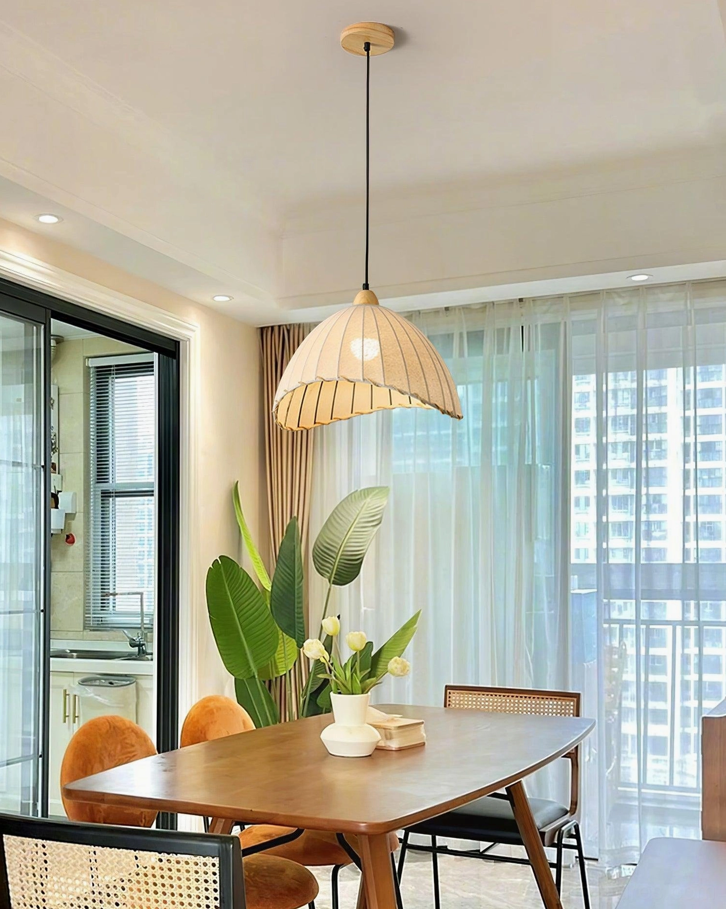 Maris pleated linen pendant light with blackened metal frame and scalloped trim detail