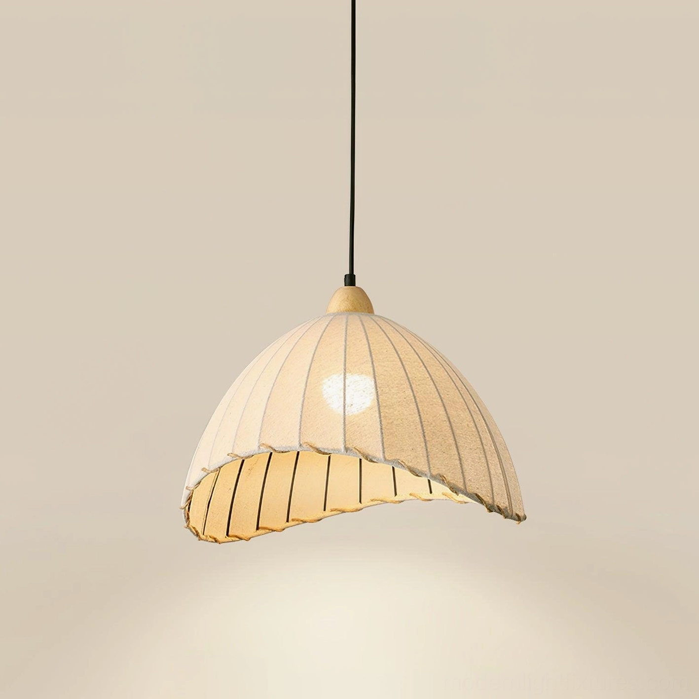 Maris pleated pendant light installed over dining table in Scandinavian interior design