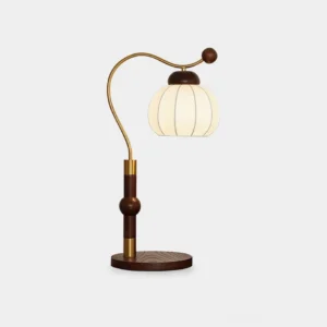 Marisa arched table lamp with brass arm and frosted glass pumpkin shade on white background, showcasing mid-century modern design with wooden base