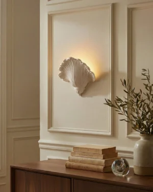Mariselle wall sconce installed on paneled wall warm backlight living room ambiance
