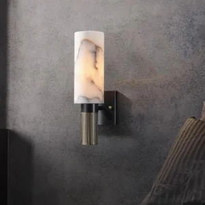 Contemporary marble wall lamp mounted in bedroom setting with warm ambient light glow
