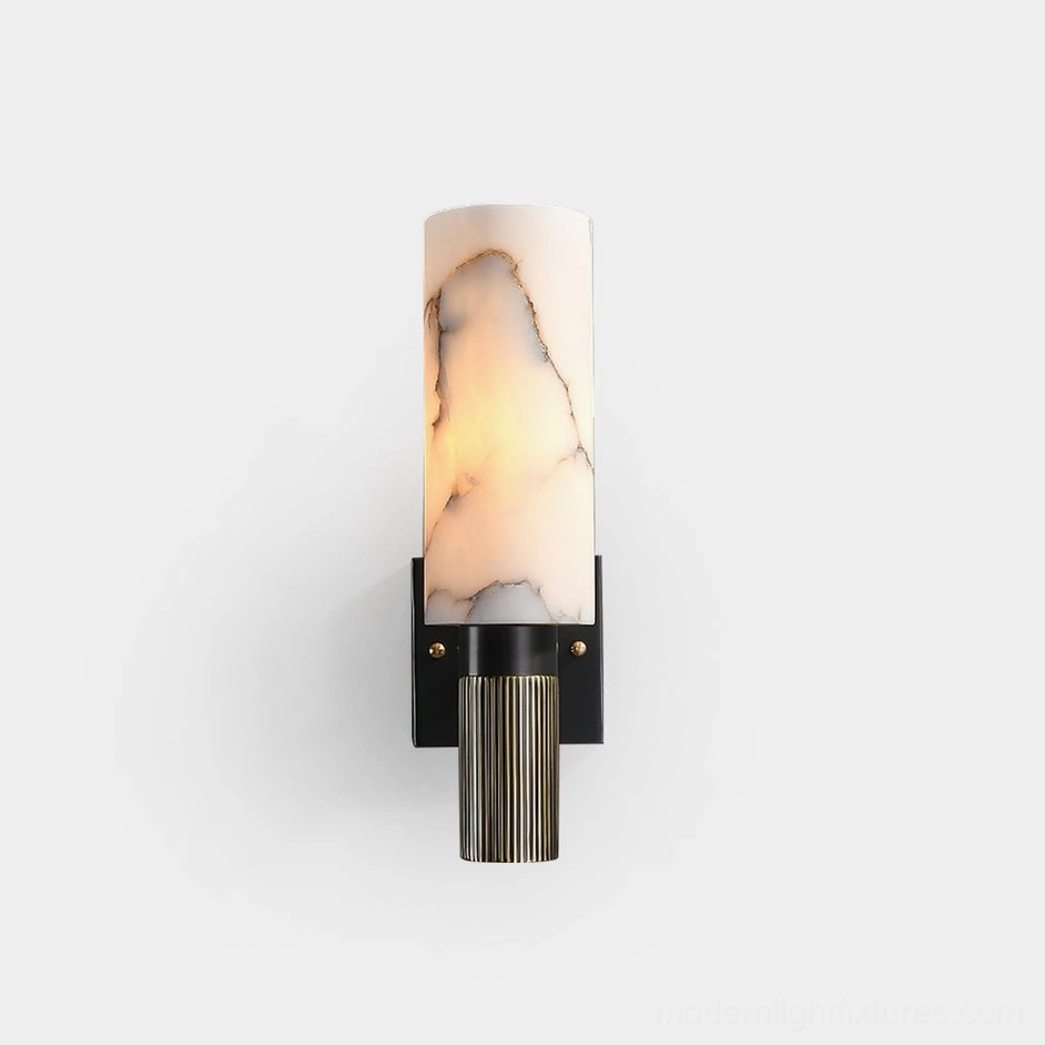 Marlo alabaster wall sconce front view with marble-veined cylindrical shade and brass accents