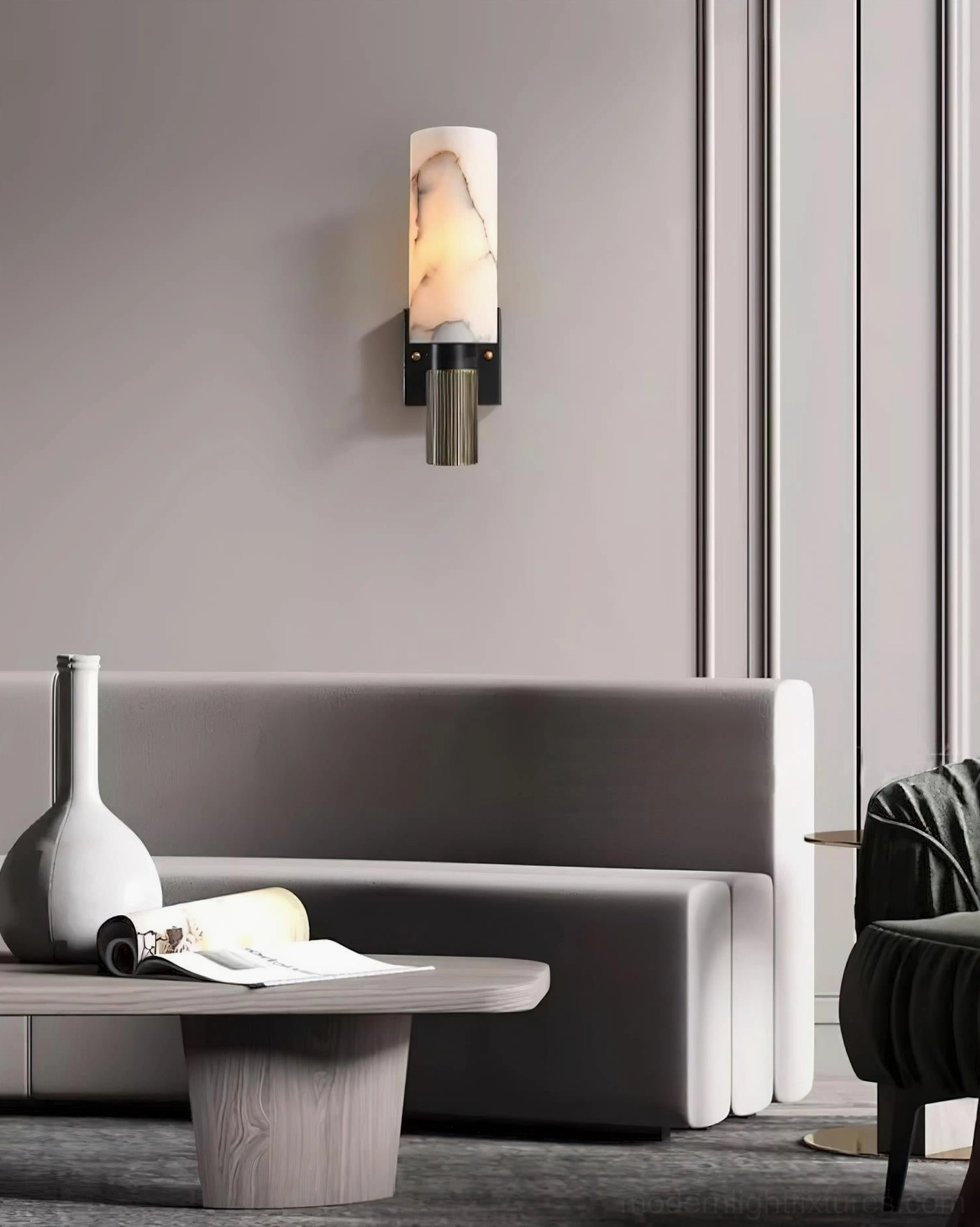 Marlo wall sconce detail shot highlighting brass grooved base and alabaster cylinder