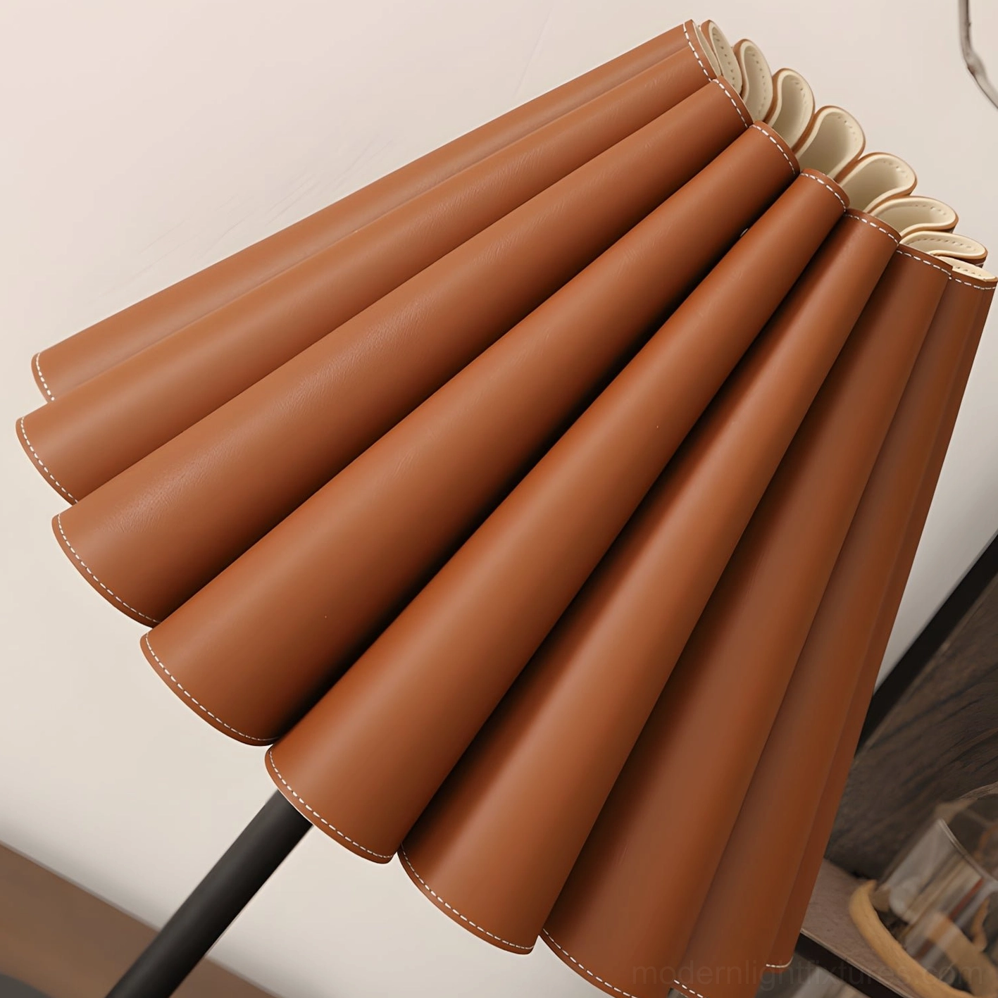 Marlow lamp shade side close-up view showing tan faux leather accordion pleats and precision stitching detail