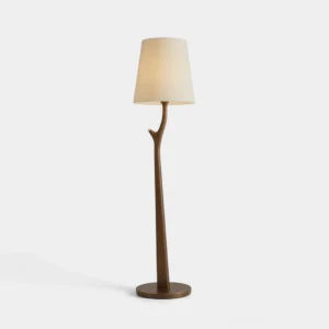 Marlow carved branch floor lamp with ivory linen drum shade and solid wood base in warm light oak finish, studio front view