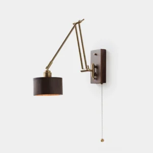 Marlow adjustable brass wall sconce with articulated swing arms in gold finish and walnut wood shade on plain white studio background