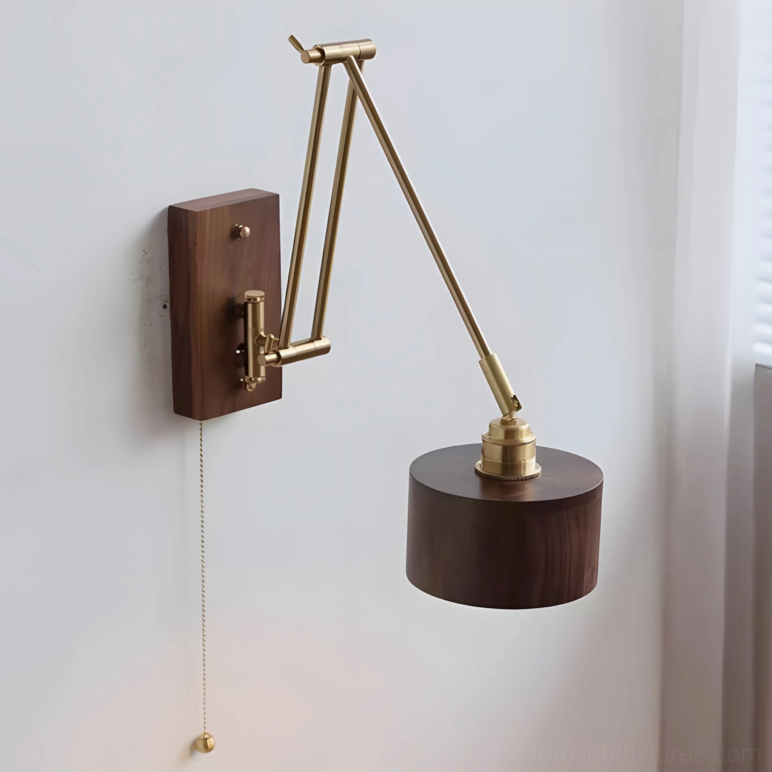 Marlow brass and walnut wood wall sconce in ambient interior setting demonstrating warm light quality and design elegance