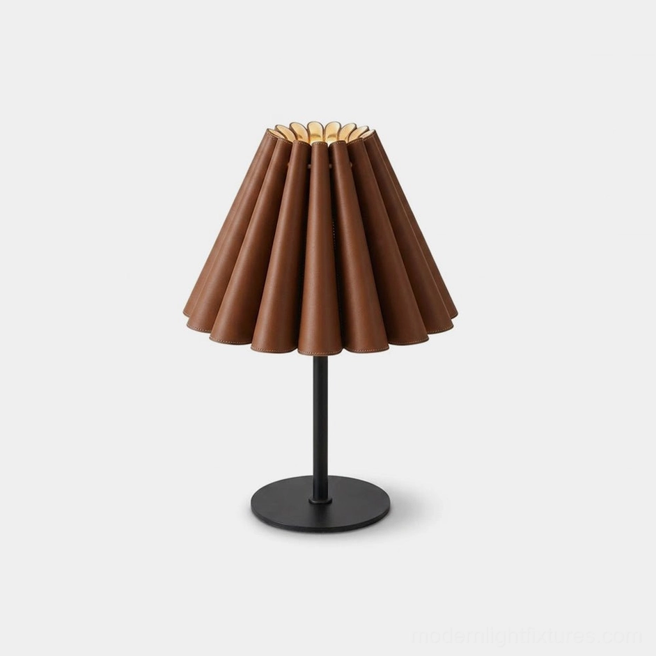 Marlow pleated leather table lamp front view with tan accordion shade and matte black metal stem on white studio background