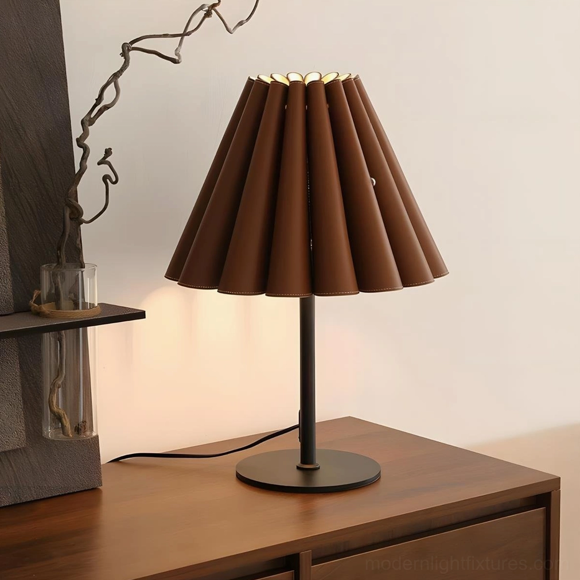 Marlow leather accordion pleated table lamp three-quarter view on vintage wooden side table with decorative plant