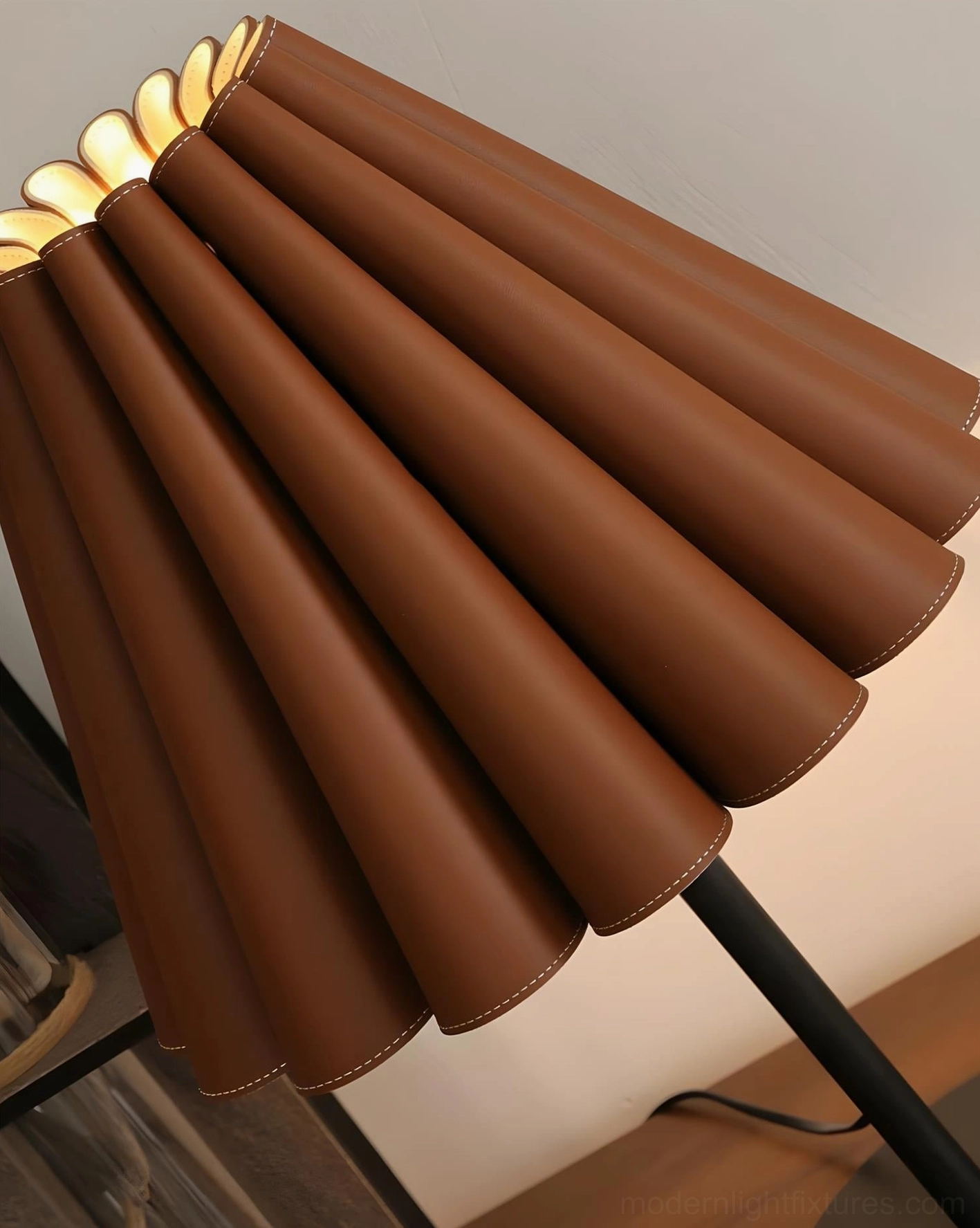 Close-up detail of Marlow lamp pleated shade showing accordion folds and stitched leather edges with black metal pole