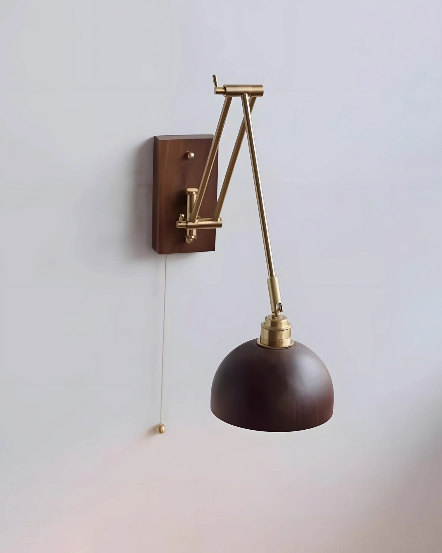 Adjustable wall sconce with full articulated swing arm extended showing maximum reach and directional lighting capability