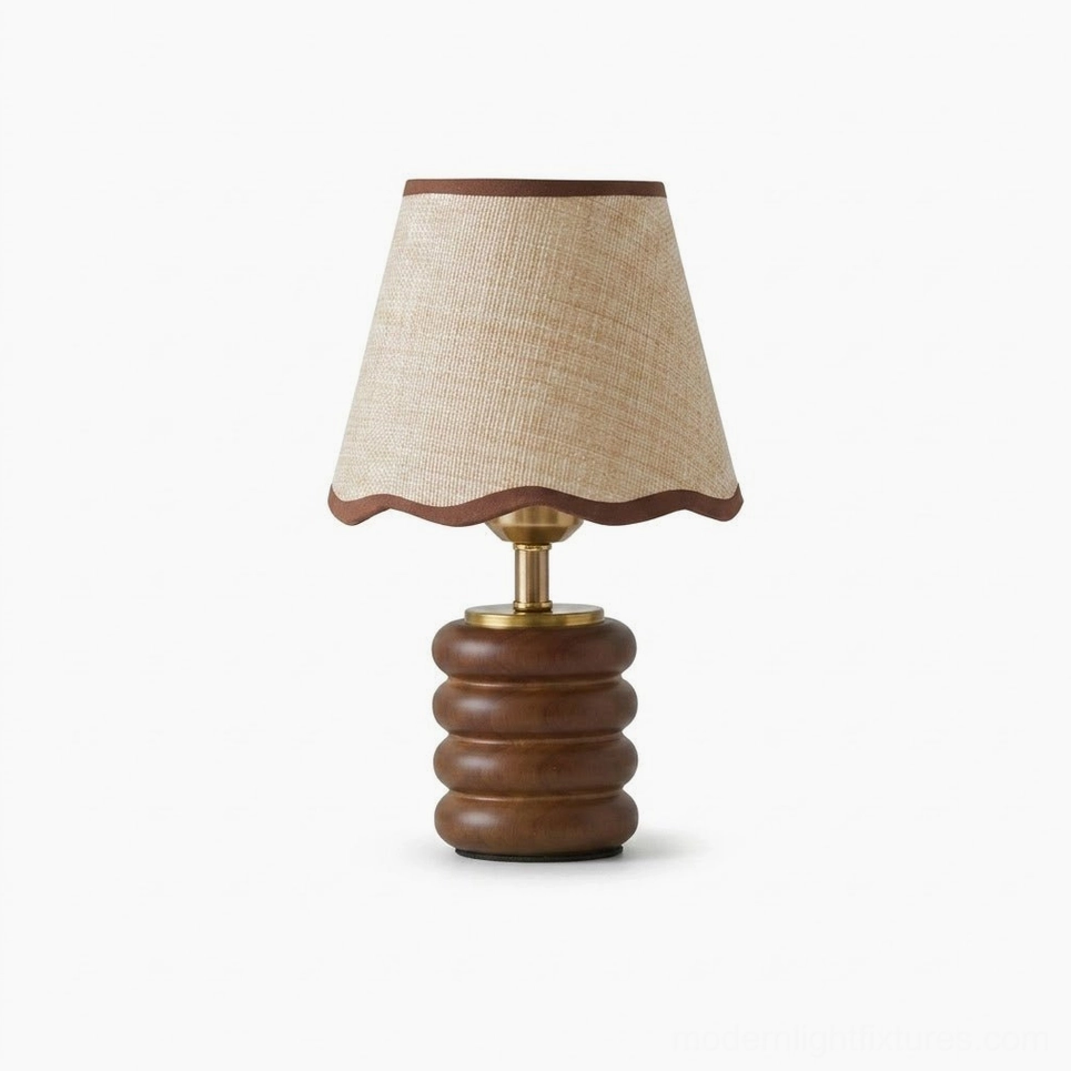 Marlowe walnut wood table lamp with tapered scalloped edge shade and brass stem, studio flat lay on white