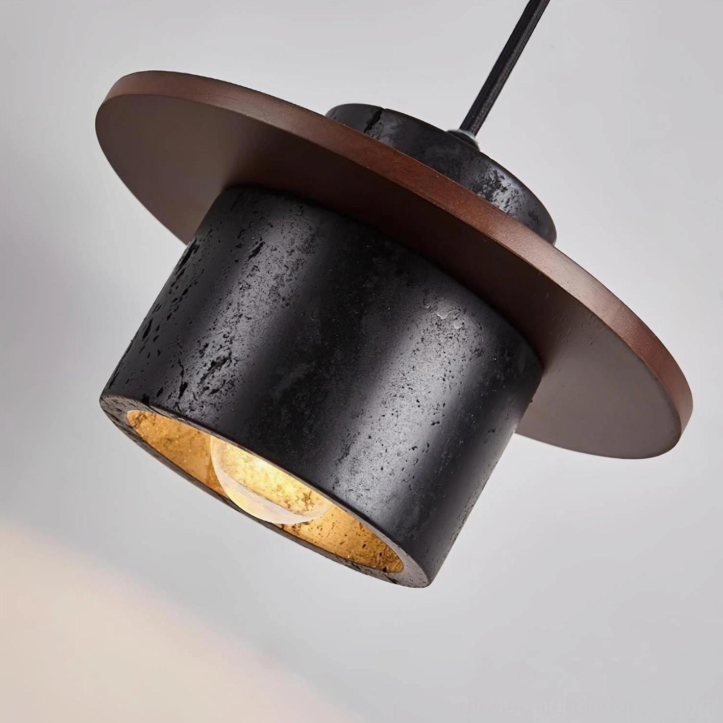 Contemporary sculptural pendant light collection showcasing varied geometric forms and materials