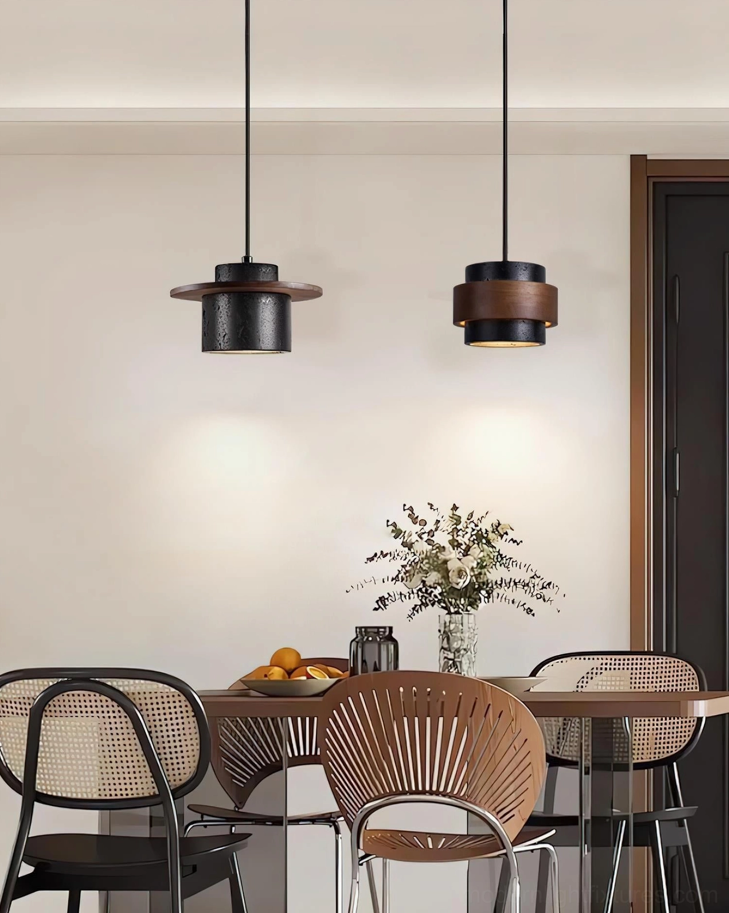 Modern pendant light cluster in Nordic minimalist dining space with light wood table and decorative flowers