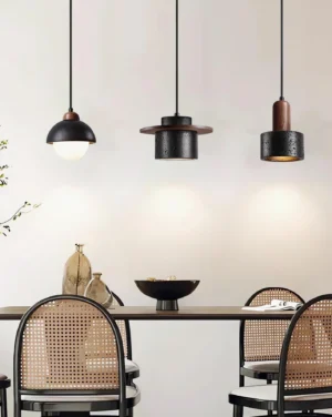Marnox pendant lights installed above dining table in contemporary minimalist interior with rattan seating