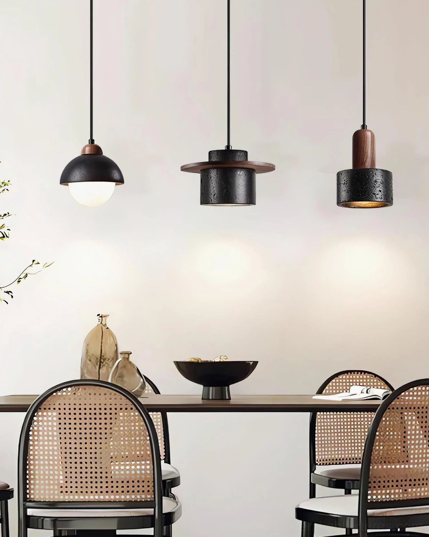Marnox pendant lights installed above dining table in contemporary minimalist interior with rattan seating
