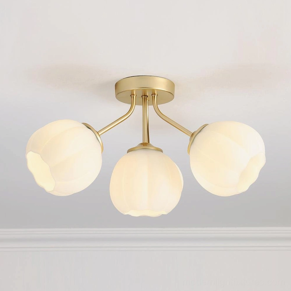 3-head Marra floral ceiling light with low-angle view showing brushed gold metal frame and simple rounded frosted glass shades