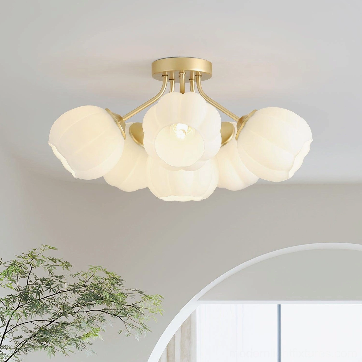 6-head Marra floral ceiling light fixture installed in modern home interior with arched doorway, warm ambient lighting and gold hardware