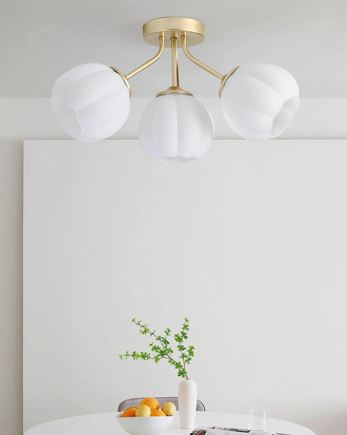 Marra floral ceiling light fixture detail showing brushed gold metal frame and frosted glass petal-shaped shades