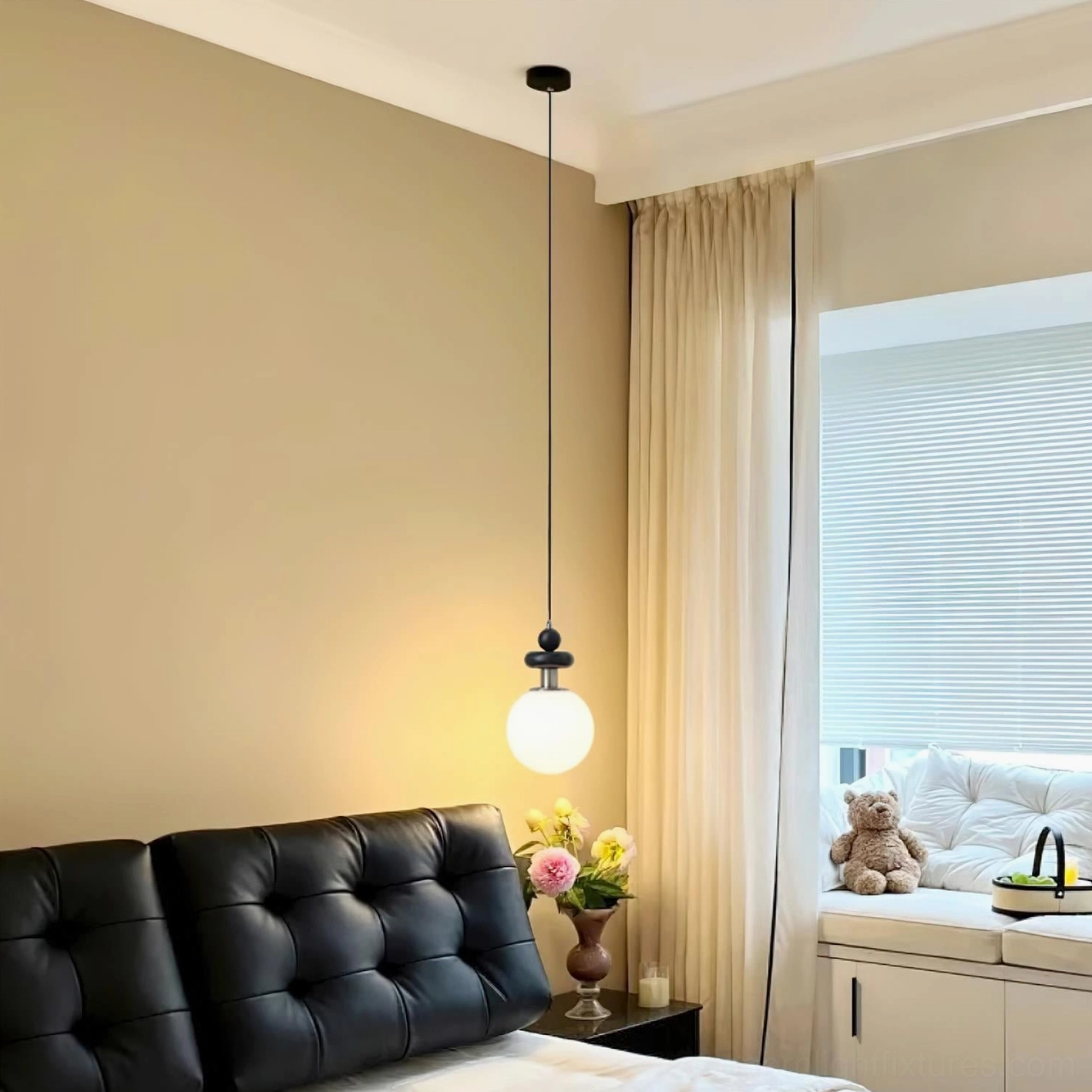Marra Globe Pendant Light creating warm ambient lighting in master bedroom with bay window, modern pendant fixture overhead