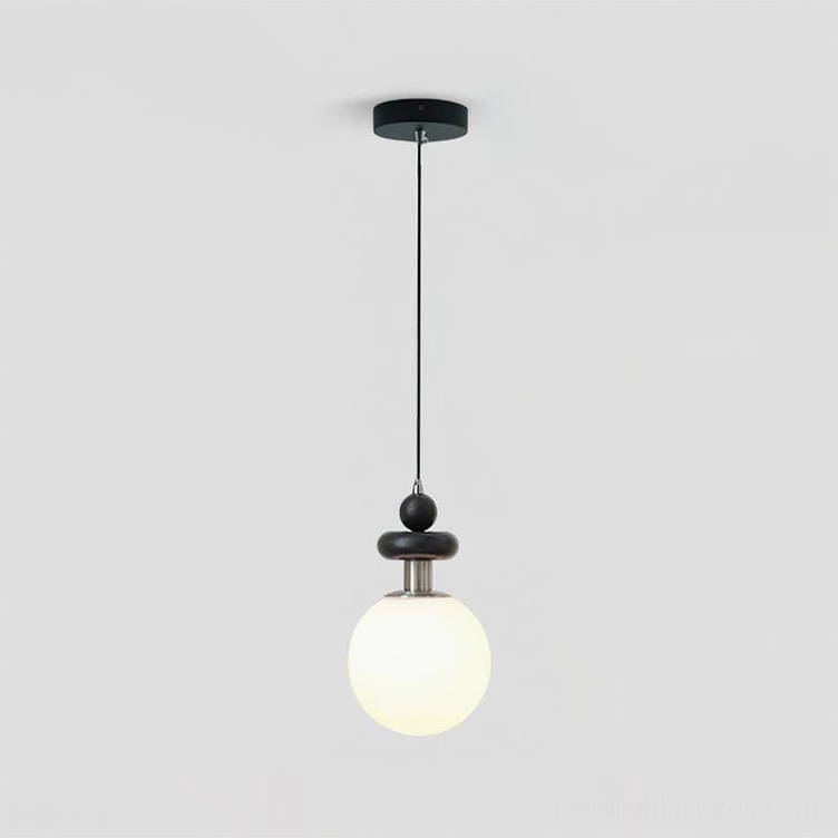 Marra Globe Pendant Light - Black & White variant with matte black ceiling mounting base, studio flat front view