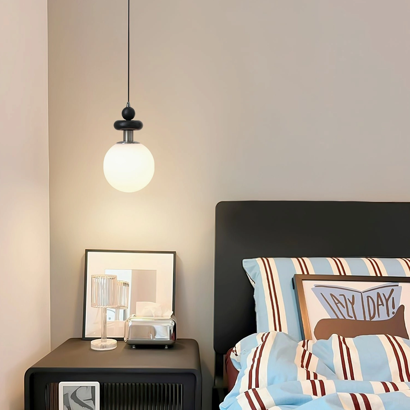 Marra Globe Pendant Light alternative color variant in contemporary minimalist room setting, modern pendant light fixture
