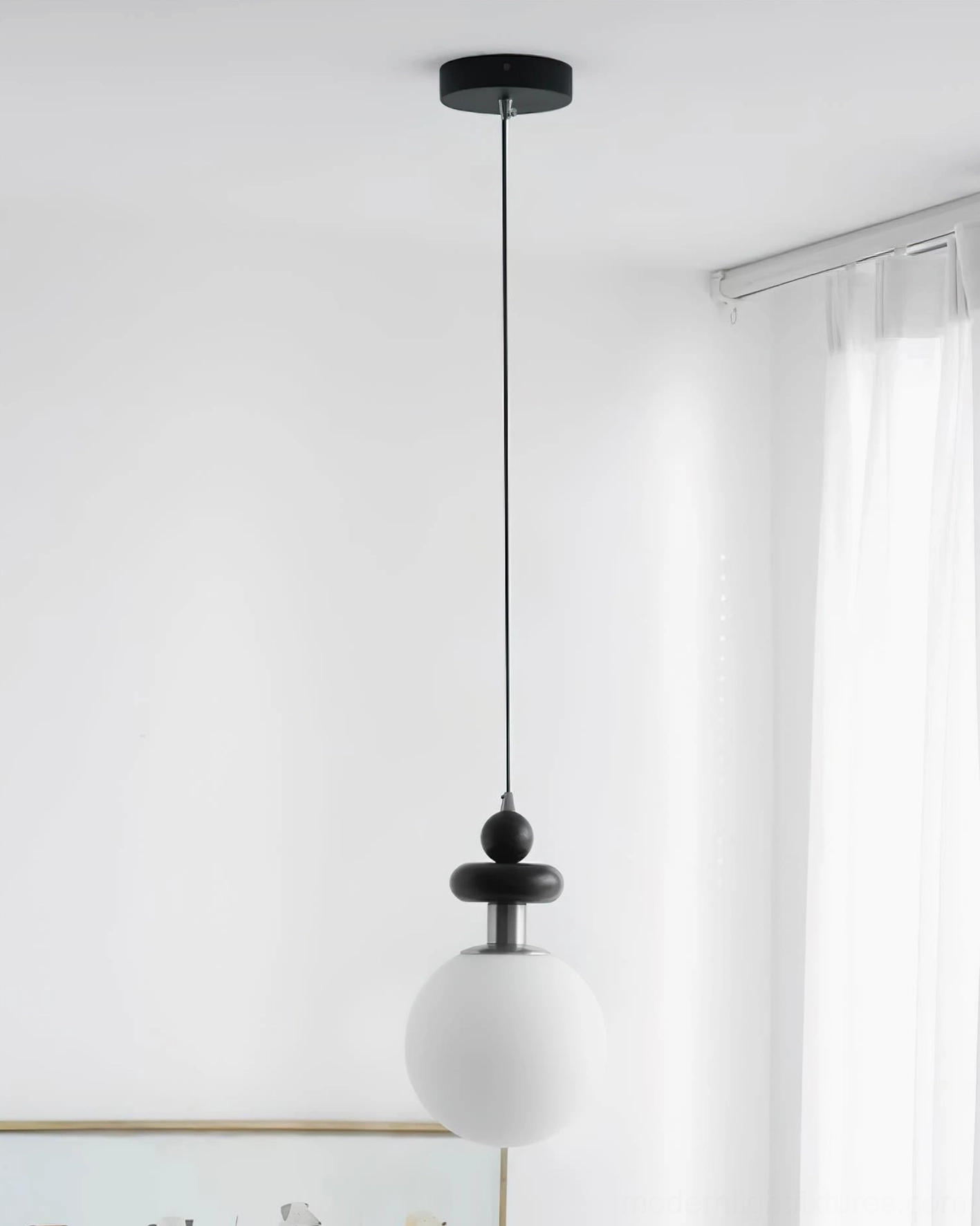 Marra Globe Pendant Light suspended in modern home space, architectural view of stacked orbs and black wood rod design